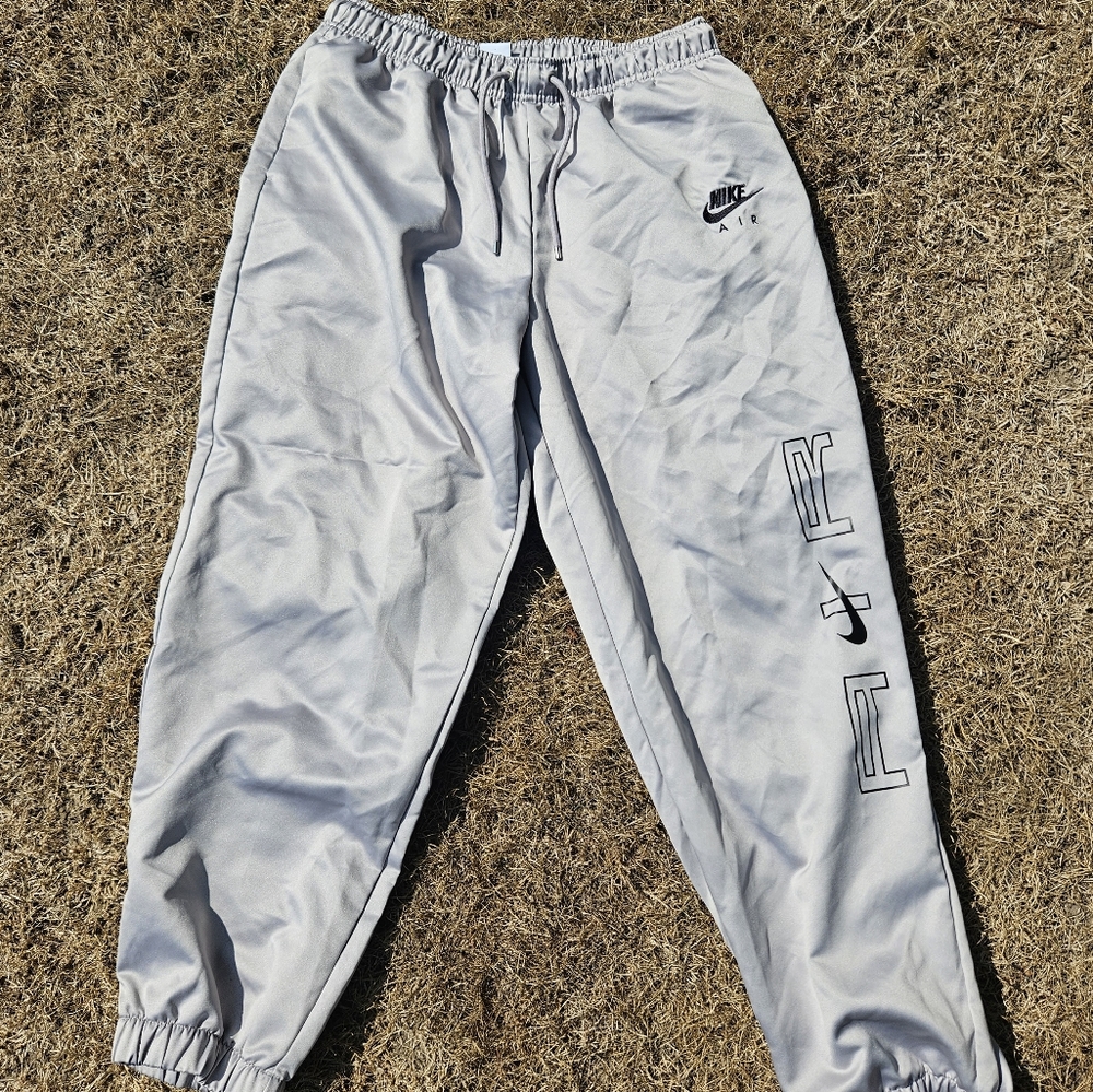 Women's Nike satin joggers.